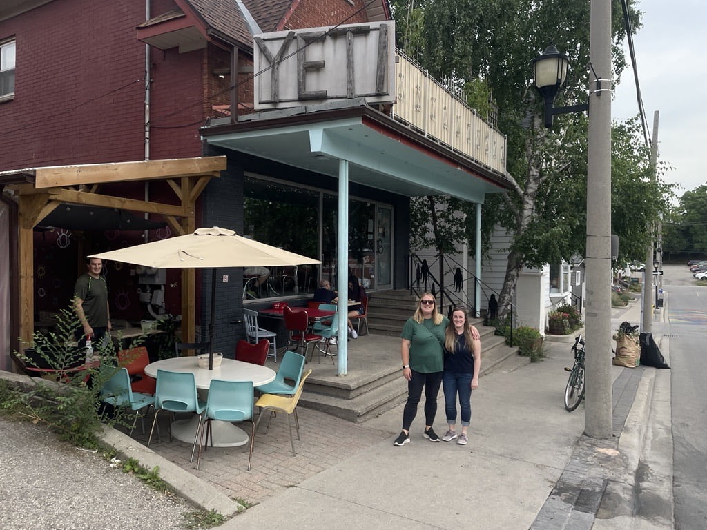 Joanna and Chelsea stand outside the Yeti Cafe in Downtown Kitchener