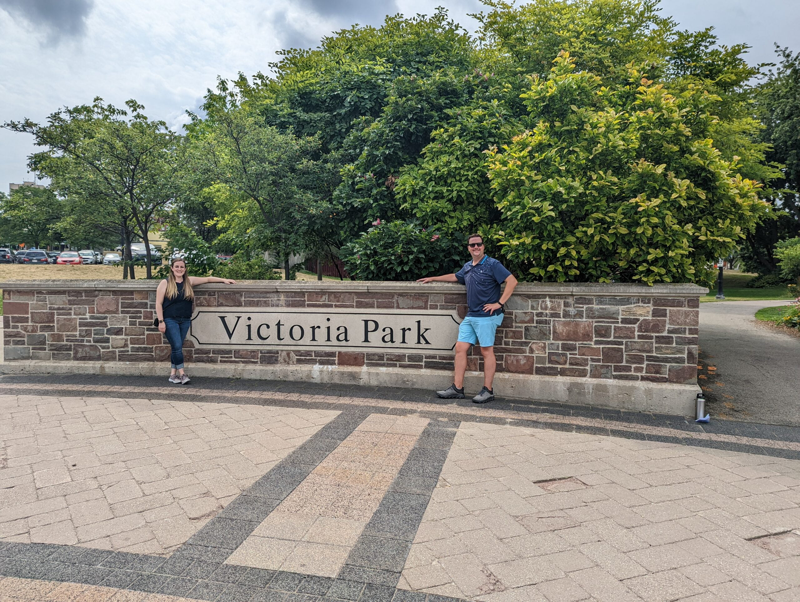 Chelsea and Jared stand in front of the Victoria Park entrance